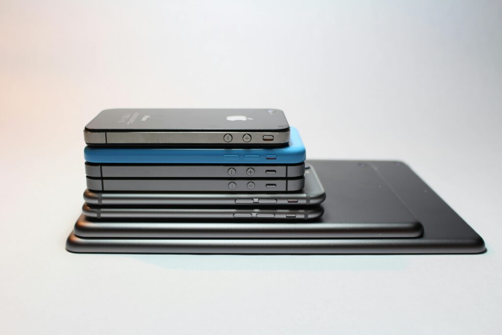 pexels-photo-341523-341523 Stacked modern smartphones and tablets showcasing sleek design. Perfect tech background.